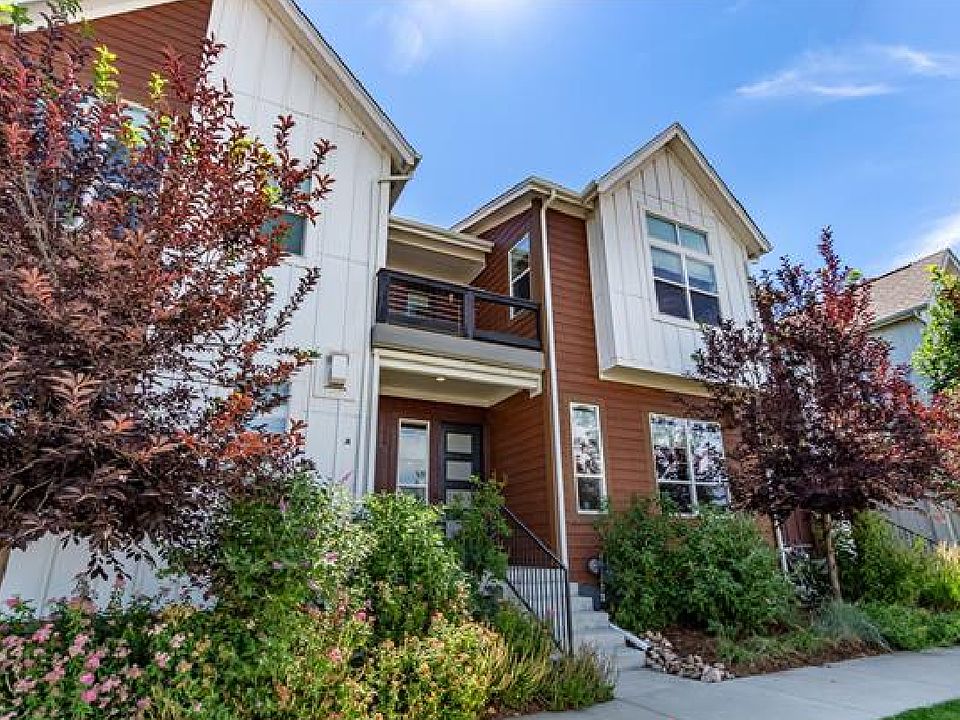 Front door with beautifully landscaped but low maintenance on smart water controller.