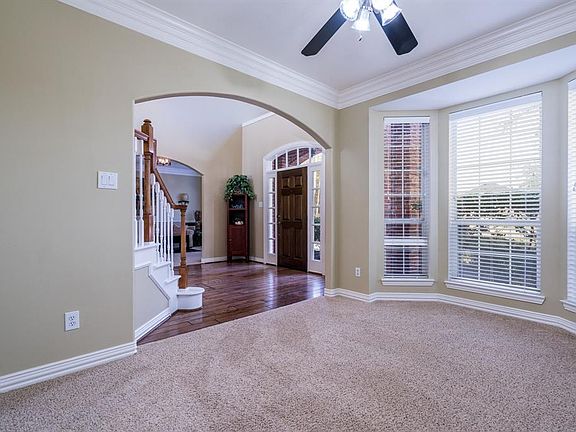 On the other side of the entry is what could be used as a study, playroom, formal living, music or craft room! A large space with a bay window and crown molding is perfect for whatever your needs may be! The carpet and paint in this home are recent, 