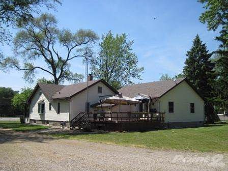 Spacious and sunny deck off of the new addition.  The umbrellas stay.