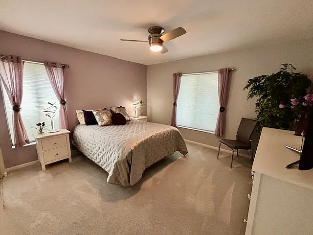 Guestroom with Queen bed, TV, two nightstands, large closet