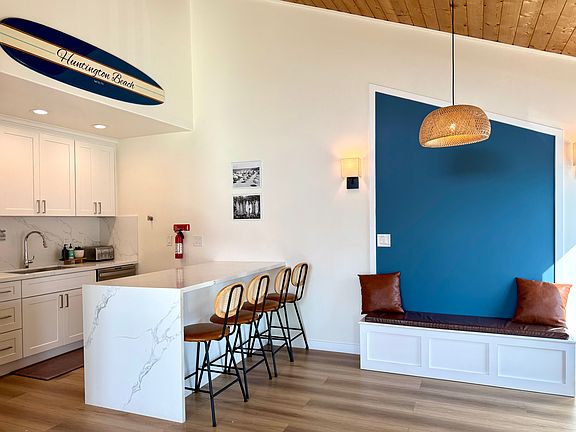 Open-style kitchen with dining area - built in bench to maximize seating!