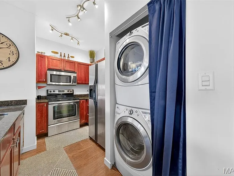 Kitchen with stainless steel appliances and full size washer/dryer included