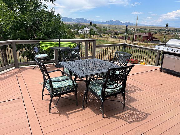 Large back deck with views of the Flatirons and Sleeping Indian
