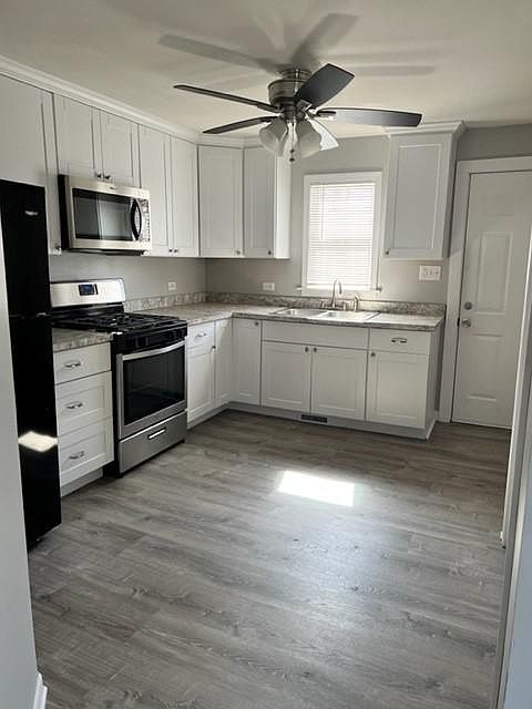Gas stainless steel stove, stainless microwave, Whirlpool refrigerator