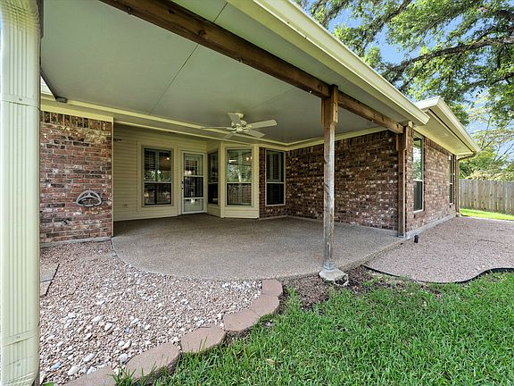 The covered patio is a delight for outdoor dining and relaxing