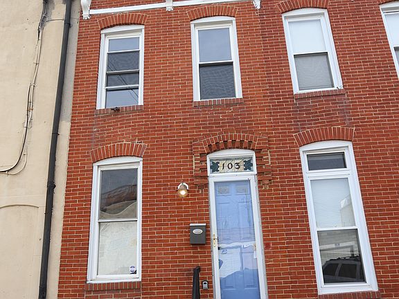 brick front with pretty blue door