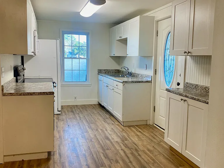 Kitchen- refrigerator/ freezer, microwave, stove/oven, sink, and dishwasher. Lots of cabinet space.