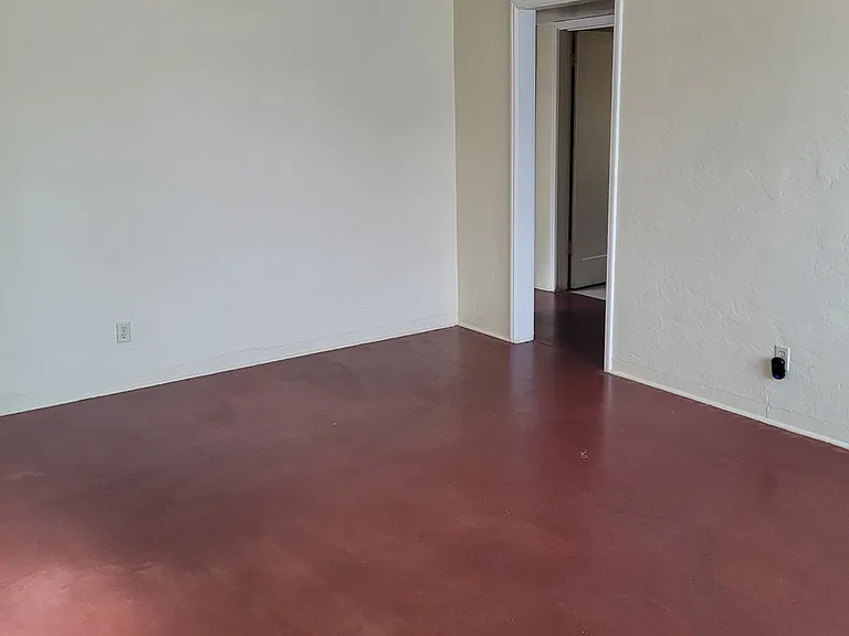 Living room and entrance to hallway. Photo taken July 2026.