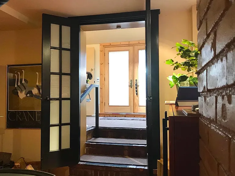 View from lower level into entry foyer.