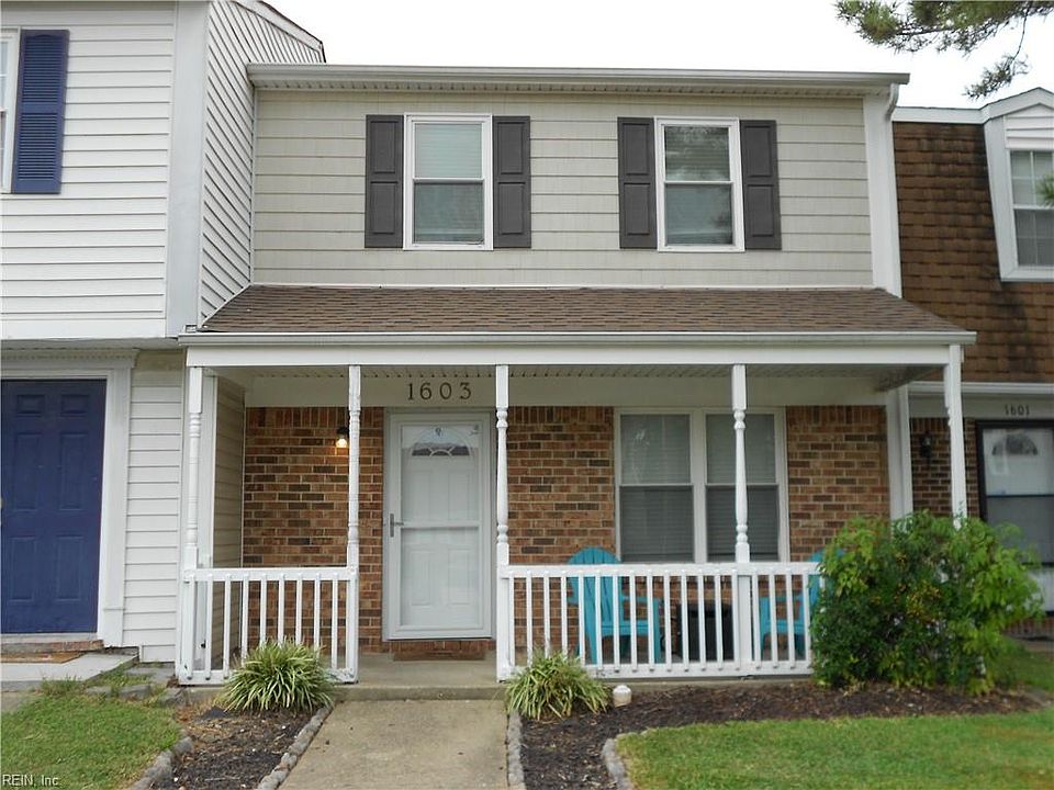Exterior front landscaped and edged lawn.
