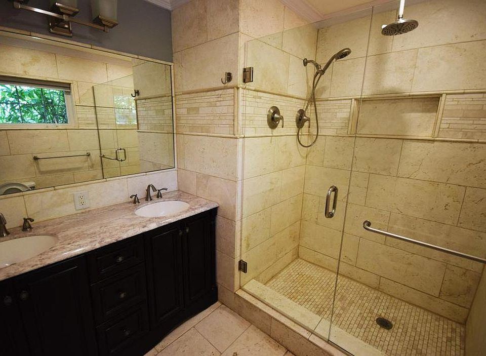 Custom master bathroom. 
With high pressure rain head 
Separate hand held both with their own temperature settings!
His and hers sinks 
With custom lighting dimmable 
Ac in bathroom 
With exhaust fan.