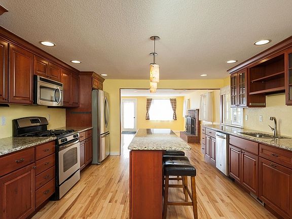 Cherry cabinets, granite counters and stainless steel appliances.