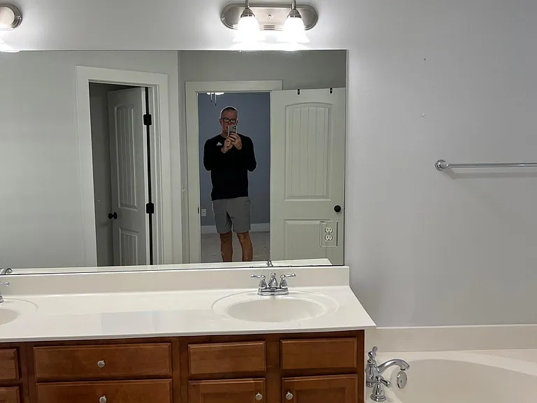 Double vanity and garden tub in master bathroom.