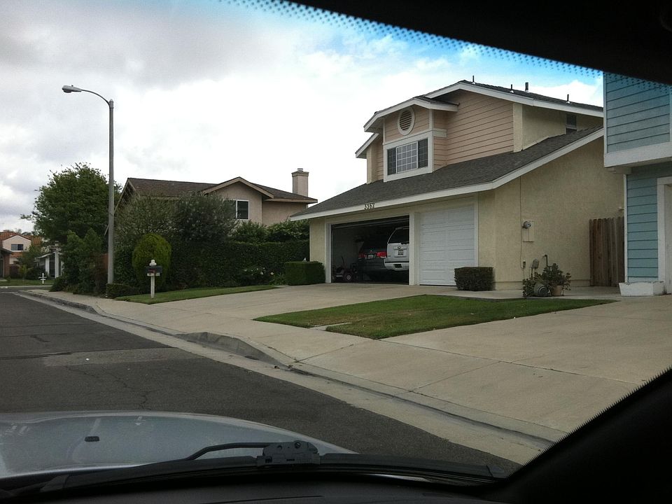Front of the house with large driveway and three-car garage 