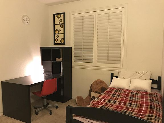Twin bed with a hardwood desk
