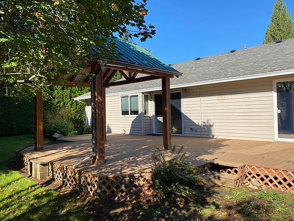 Large Deck with access from Kitchen and Primary Bedroom.