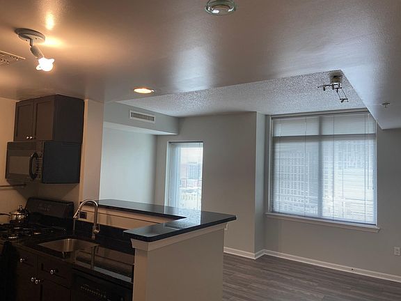 Full of natural light Kitchen, breakfast bar, and living area.