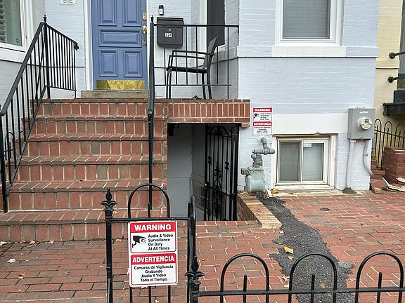 Front - Sideway view - Upper front door and gate to basement door