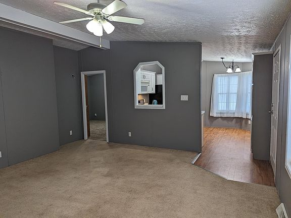 View of main room into master bedroom and kitchen