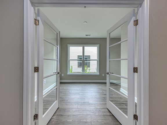 Utilize the flex room with French doors as a study.