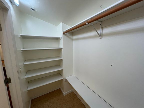 extra storage room behind bathroom