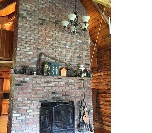 This fireplace has 8500 antique bricks, starts one floor below in the family room where there is a wood burning insert