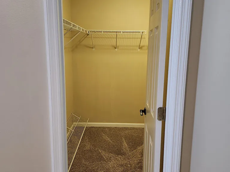 Master Bedroom - Walk-in closet with lots of space and shelving/racks.