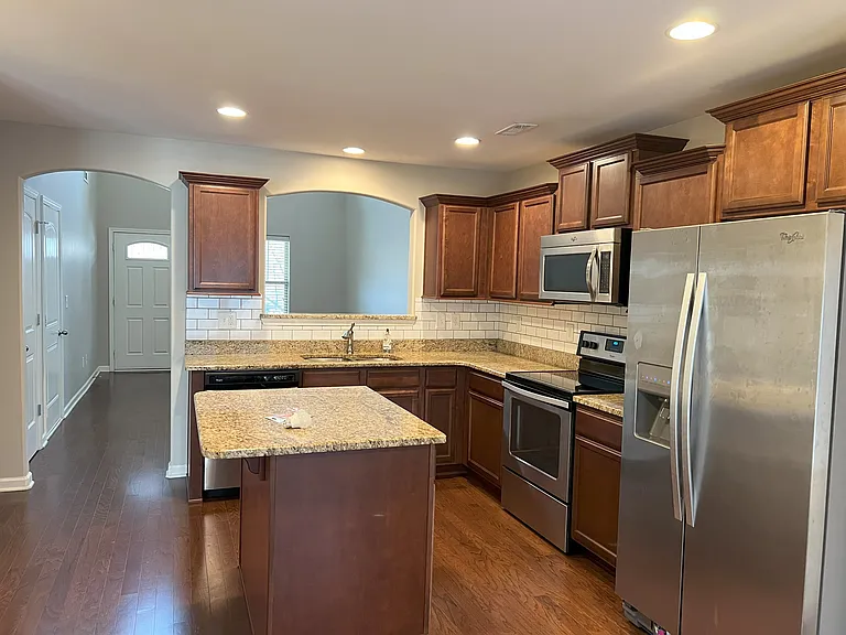 Granite counter tops w/ tiled backsplash