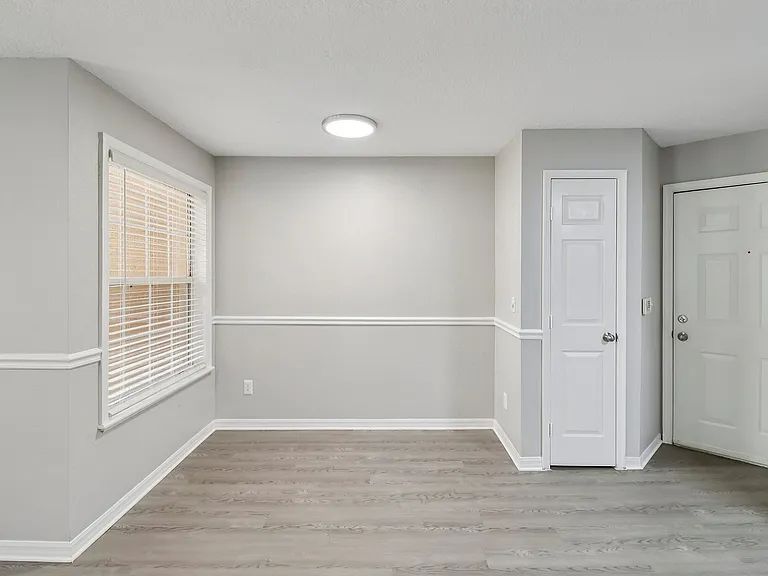 Open dining area with convenient access to entry and storage