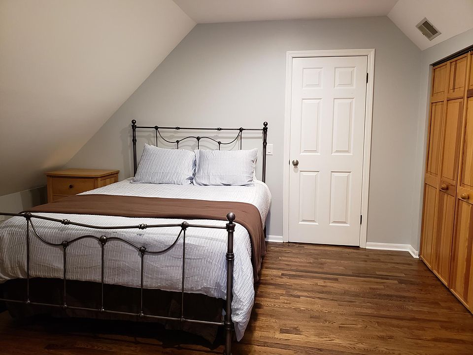 Upstairs bedroom with queen size bed in picture