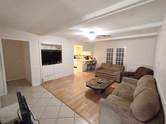 FAMILY ROOM WITH BUILT IN AND STORAGE