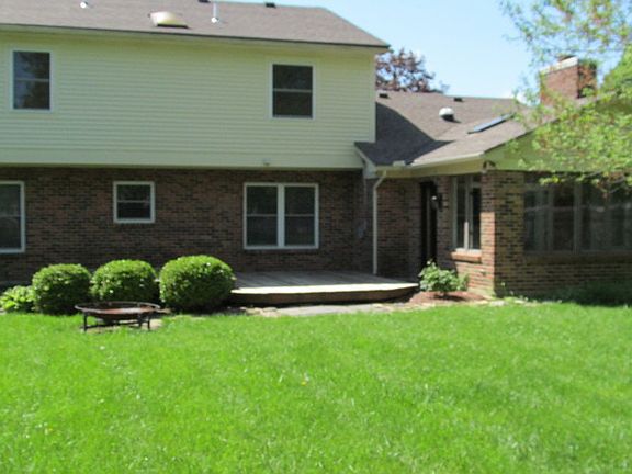 Back showing sun room and deck
