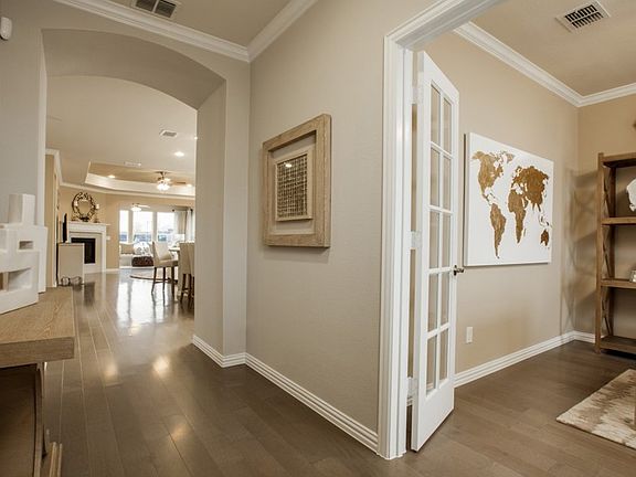 Foyer with access to flexible living space, shown as study with optional french doors