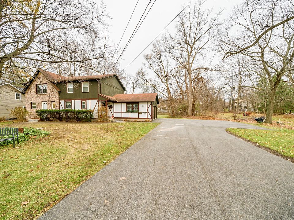 Side by Side Multi Family House with one car garage for each tenant. Turn around driveway for easy exiting