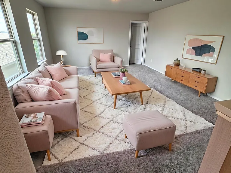 Staged family room upsttris.