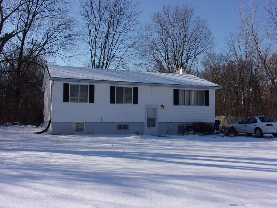 Front facade of house in winter.
