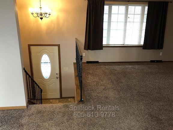 Split foyer enters to living room upstairs