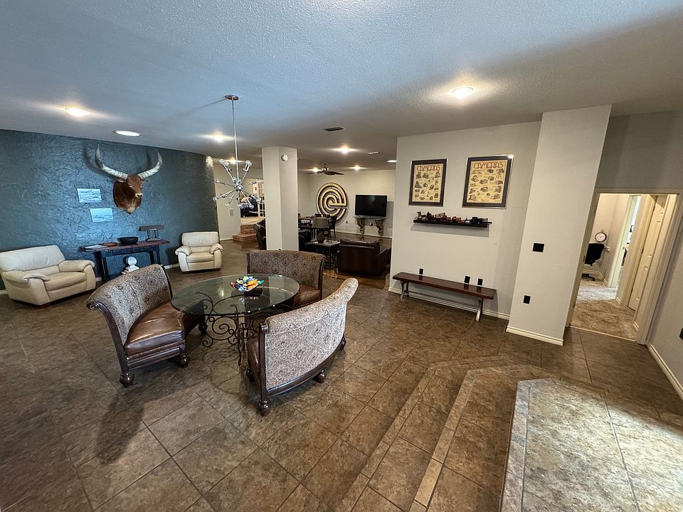 Dining area, living area in middle back of photo, two bedrooms and full bath off hallway depicted on the right.