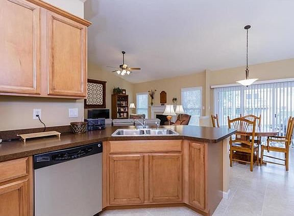 Kitchen with Staggered Maple Cabinetry