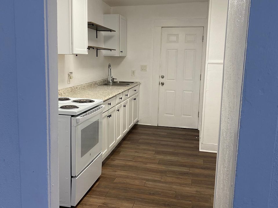 Kitchen Area: new cabinets, stove and Fridge