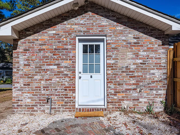 Private exterior entrance behind the home