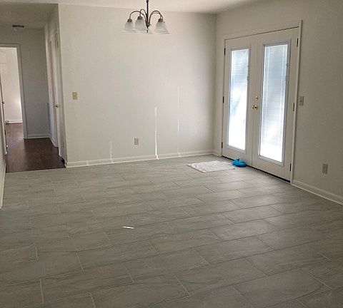Dining part of kitchen. French doors to back yard and patio.