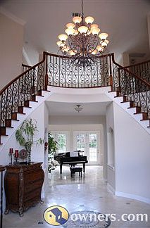 2-story entry with dual curved staircases