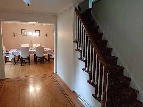 Dining room and stairs leading to the second floor.