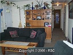 Front door with view down hall