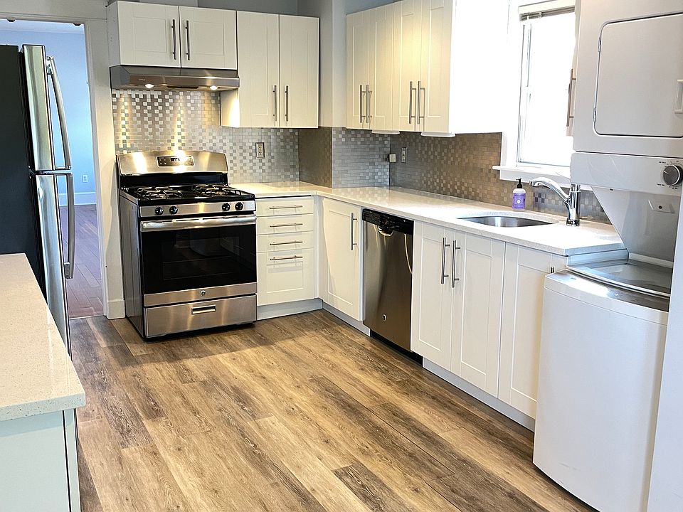 Kitchen showing stackable W/D on the right