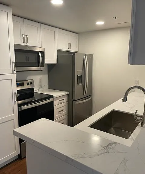 Fully remodeled kitchen with quartz counters, all new cabinets, stainless appliances.