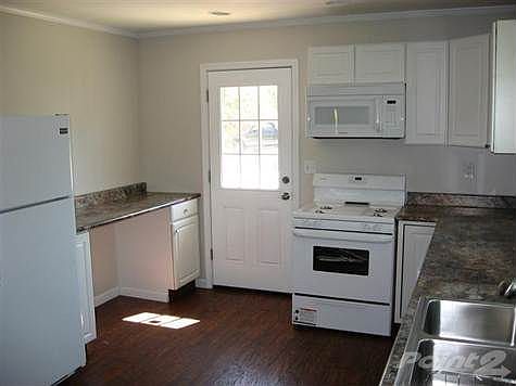 Breakfast bar area to the left.  New laminate floors.