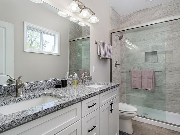 En Suite Bathroom with Dual Vanity and Spacious Shower