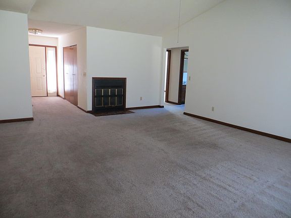 Entry and spacious family room. Fireplace decorative only.